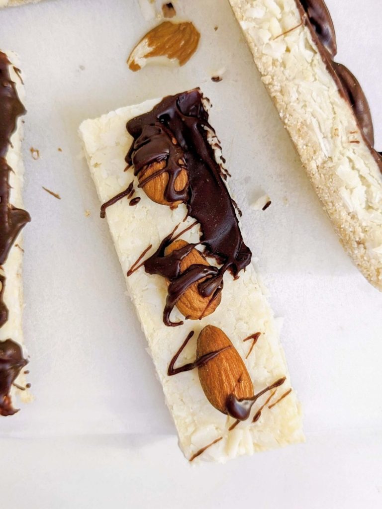 Almond Joy Protein Bars will satisfy candy cravings with health goals in check! A healthy, no sugar, high protein recipe with all the coconut, almond and chocolate vibe.