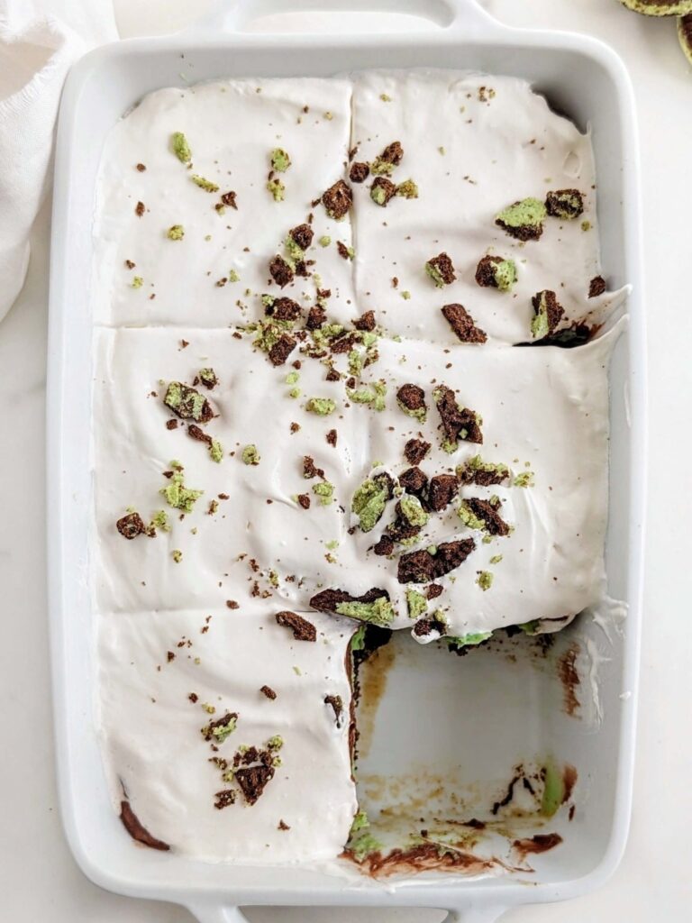 Easy and Healthy Mint Chocolate Dessert with layers of a sugar-free mint chocolate oreo base, mint protein pudding, chocolate protein pudding and low fat cool whip!