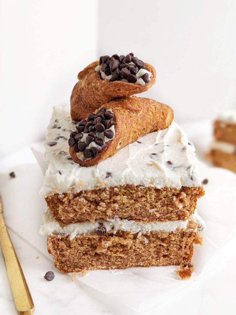 Legit the most amazing Healthy Cannoli Cake - a high protein, sugar free and low fat sponge cake with protein ricotta frosting and sugar free mini chocolate chips.