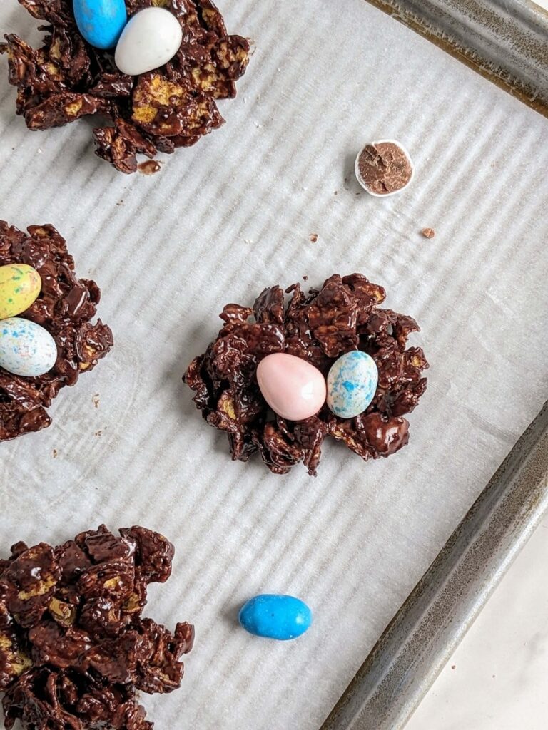 Make the best ever Protein Easter Egg Nests with chocolate protein powder and cornflakes for an easy, no bake snack! Healthy Mini Egg Nests are low fat, low sugar and low calorie.