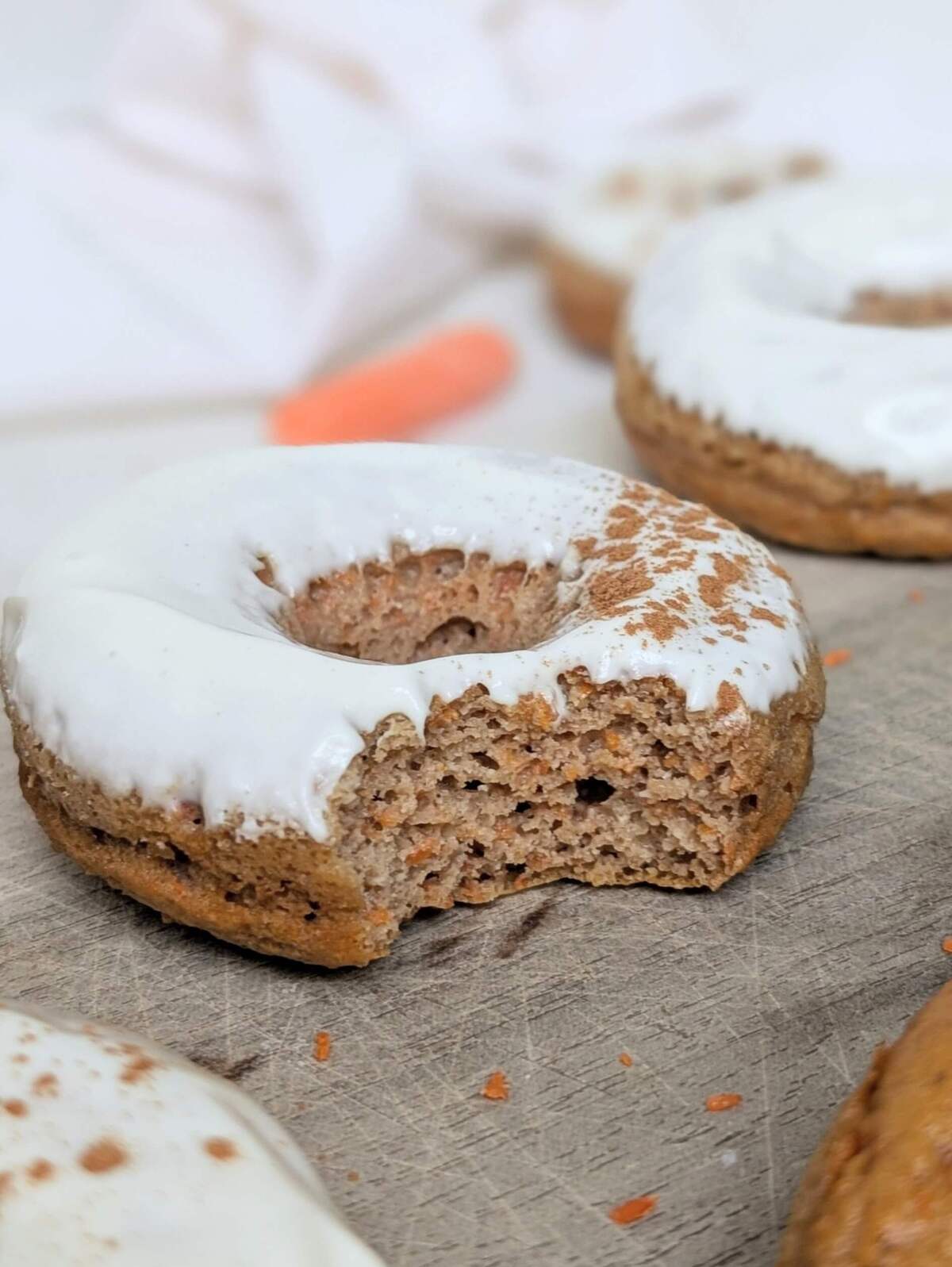 Truly the best Carrot Cake Protein Donuts that are healthy, gluten-free, low calorie and sugar-free! With almond flour and protein powder, and a protein cream cheese glaze, these carrot cake doughnuts are perfect for a low-carb breakfast or post-workout snack.