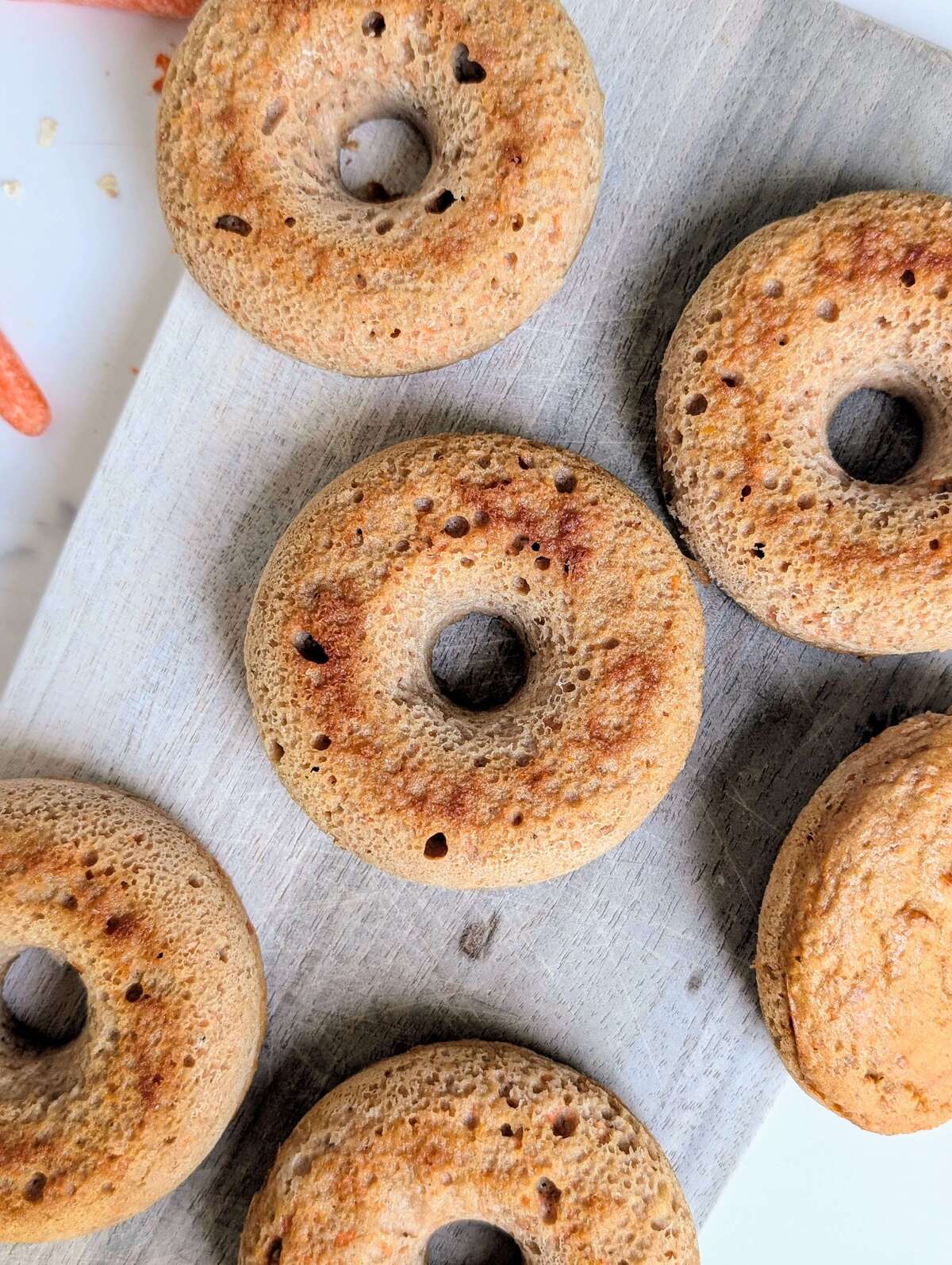 Truly the best Carrot Cake Protein Donuts that are healthy, gluten-free, low calorie and sugar-free! With almond flour and protein powder, and a protein cream cheese glaze, these carrot cake doughnuts are perfect for a low-carb breakfast or post-workout snack.