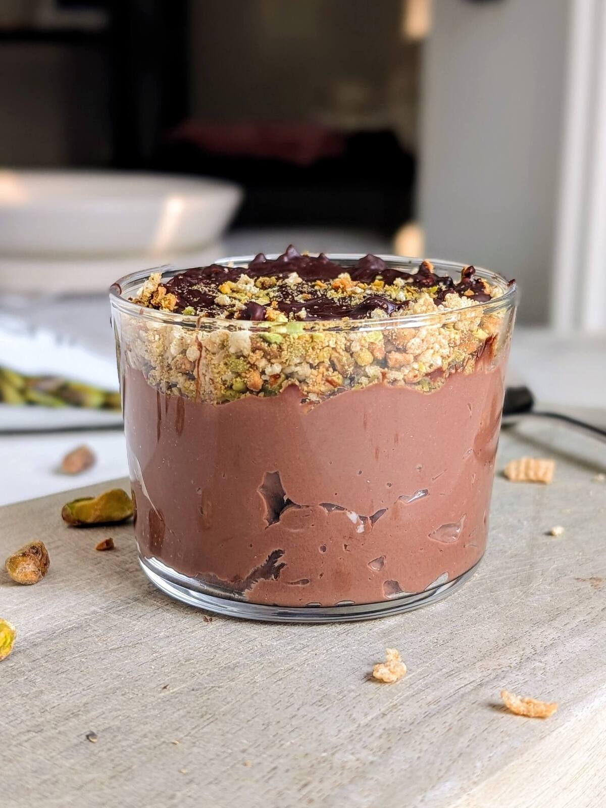 Easy and Healthy Dubai Chocolate Dessert as a protein packed alternative to the Viral chocolate bar. High protein Dubai chocolate dessert has a protein chocolate yogurt base and crushed pistachios and cereal for that crunch!