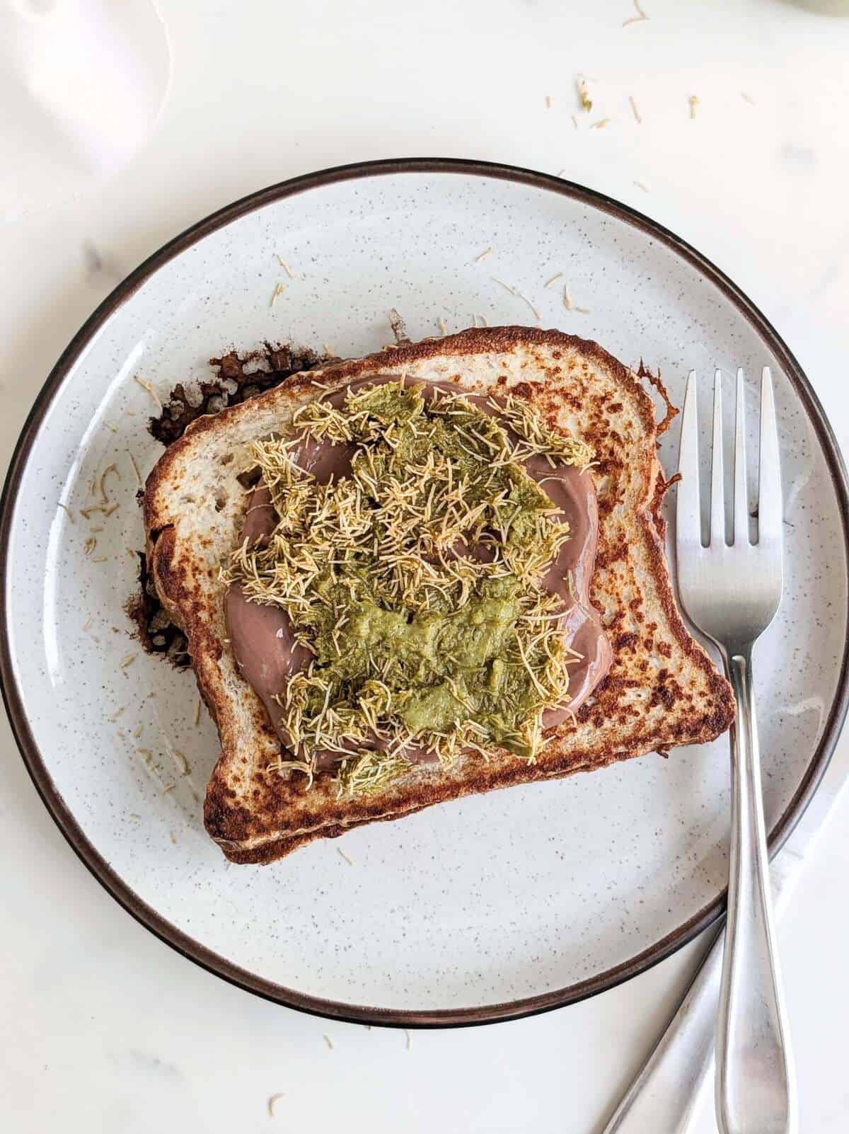 This Dubai Chocolate French Toast recipe will elevate your breakfast or dessert game! An exquisite high protein, lower fat and low sugar pistachio chocolate stuffed french toast you’re going to love!