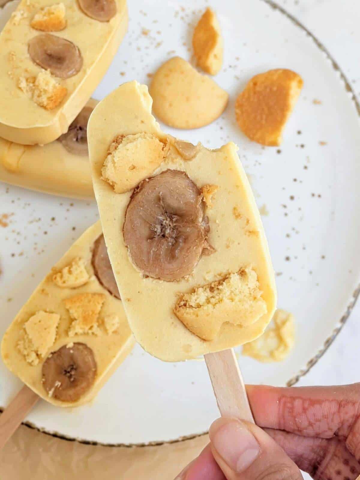 These Banana Pudding Protein Popsicles are packed with creamy banana flavor and crunch from the nilla wafers, but low in sugar, and really high in protein! They make the perfect post-workout snack or guilt-free dessert.