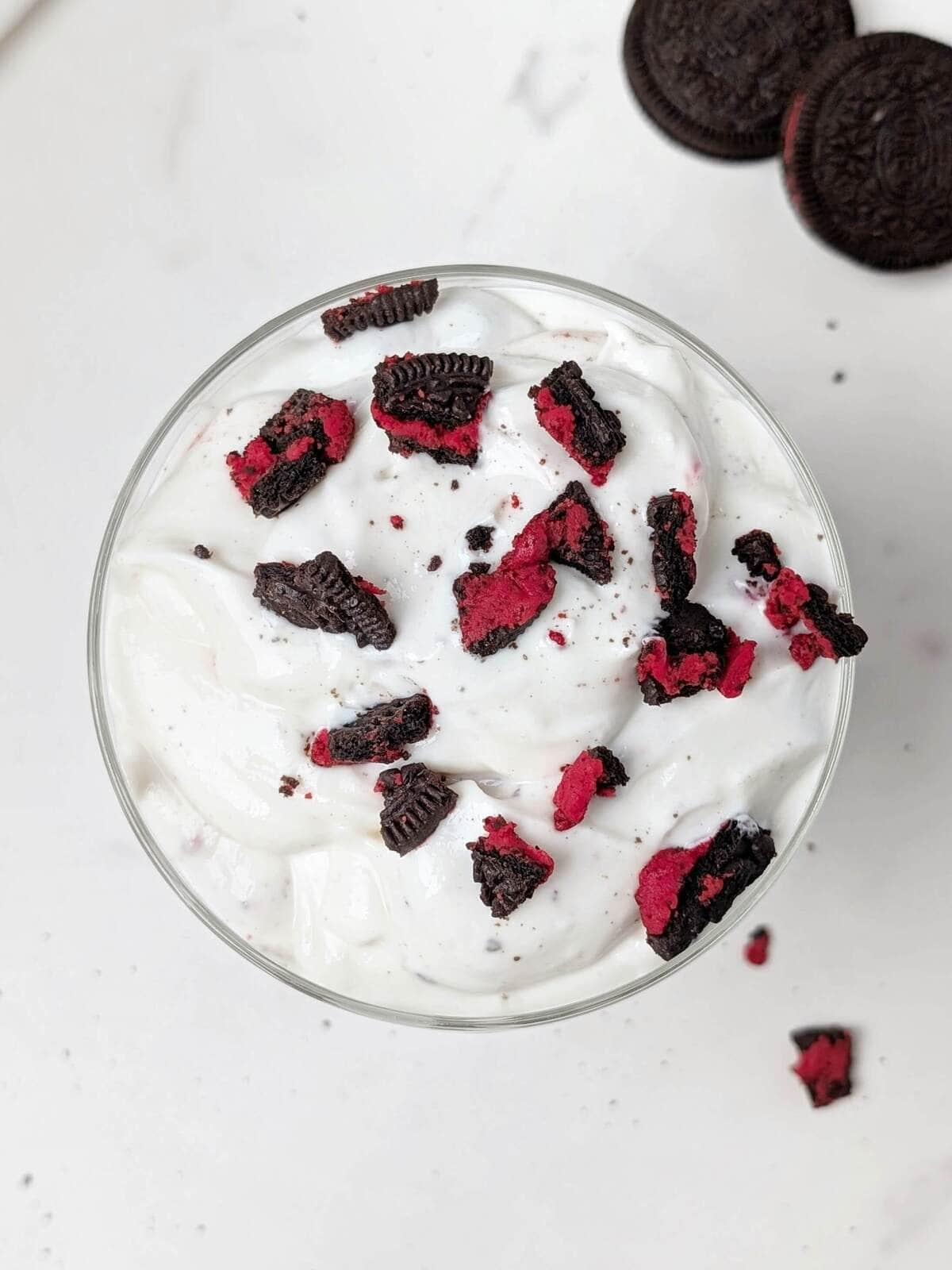 This Healthy Oreo Fluff is a 4-ingredient, high-protein, low-calorie dessert made with Greek yogurt, protein powder, and real Oreos! Spare a few minutes and you’ve got a quick low calorie, low fat and low sugar Oreo dessert.