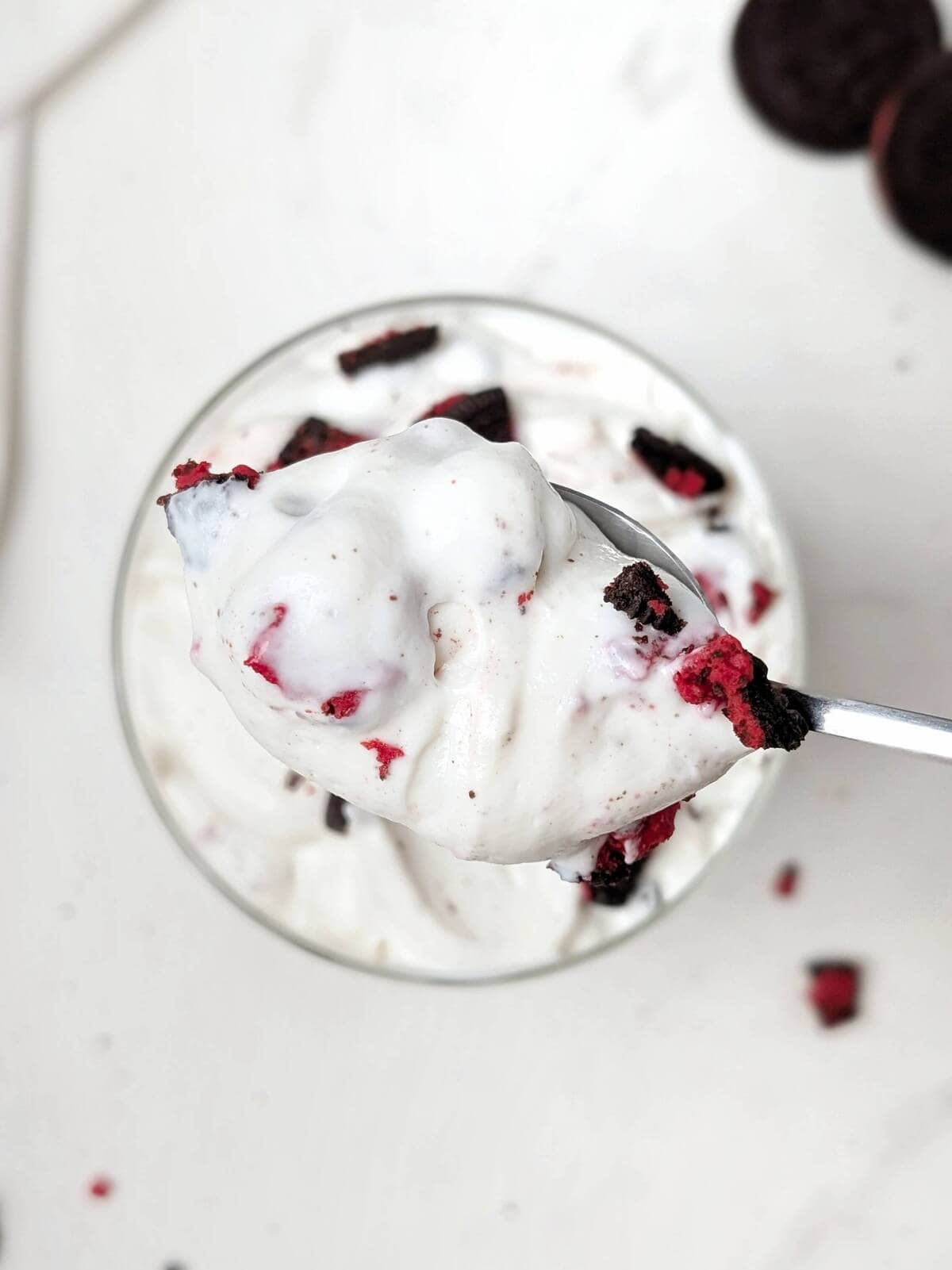 This Healthy Oreo Fluff is a 4-ingredient, high-protein, low-calorie dessert made with Greek yogurt, protein powder, and real Oreos! Spare a few minutes and you’ve got a quick low calorie, low fat and low sugar Oreo dessert.