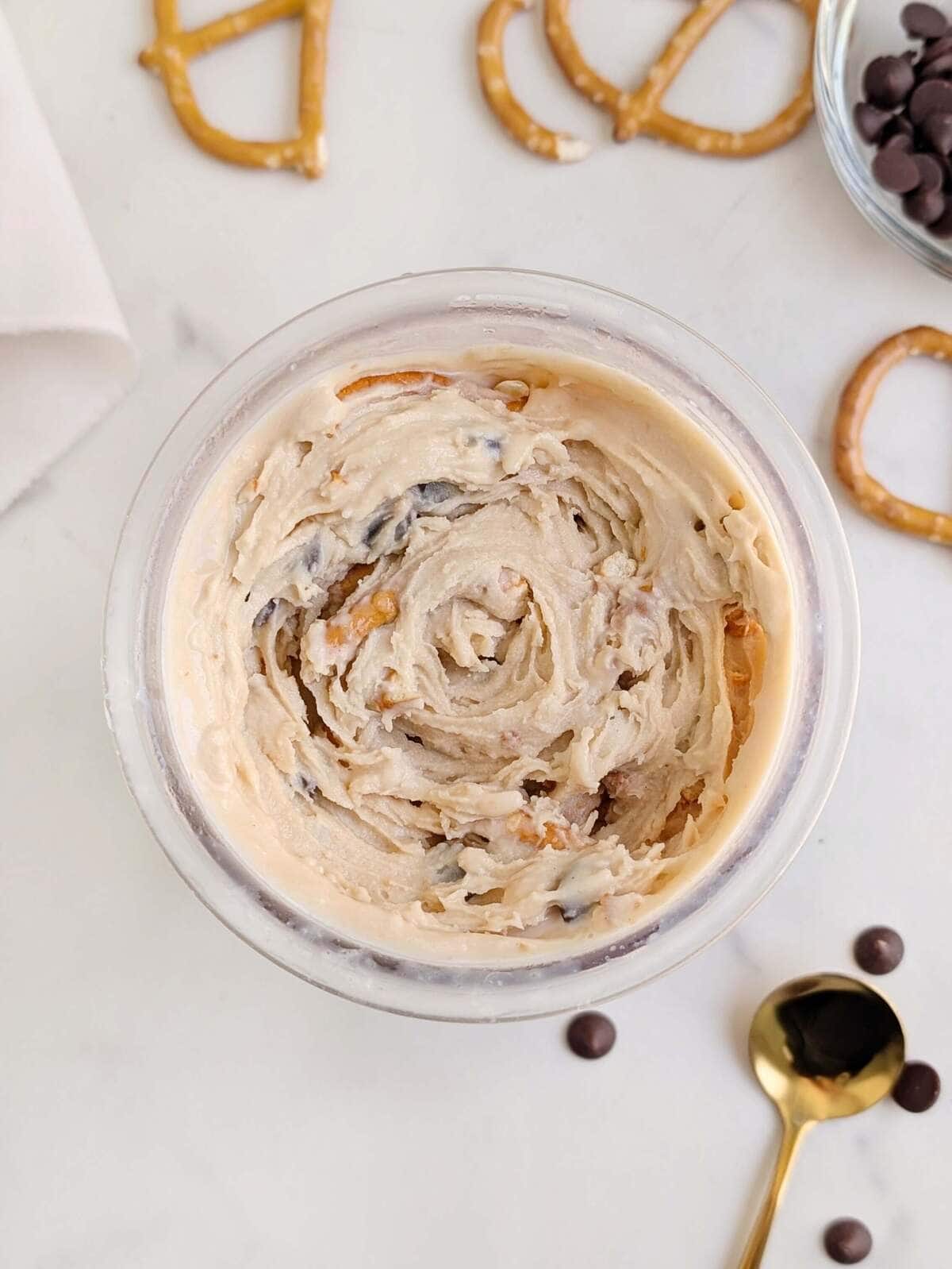 The best Salted Caramel Protein Ninja Creami Ice Cream recipe that’s creamy and satisfying, but still healthy! An easy, keto friendly salted caramel creami recipe that’s even customizable with chocolate chips and pretzels!