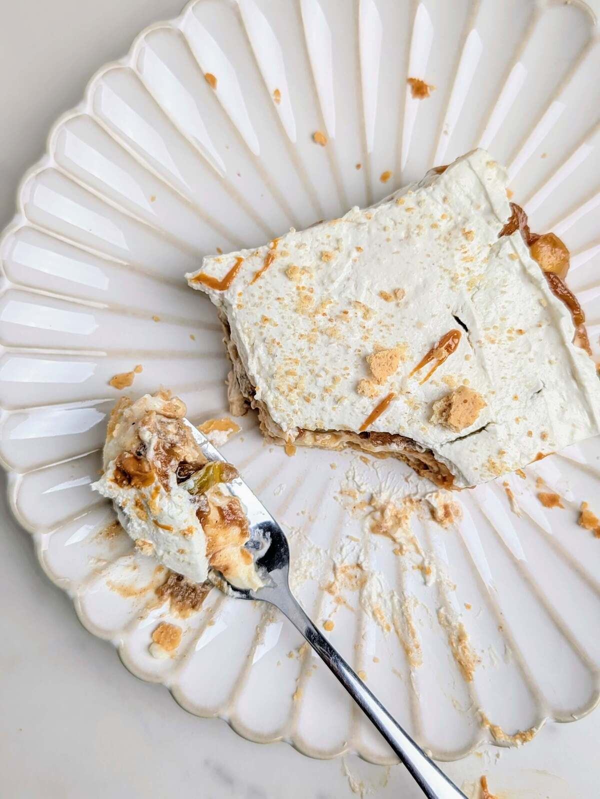 Healthy Apple Pie Lasagna is the ultimate twist on a classic holiday pie. Crunchy pie crust, high protein pudding, low-sugar apple pie filling and protein whipped topping - a decadent dessert without guilt.
