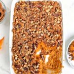 High protein sweet potato casserole is the best healthy Thanksgiving dessert recipe. A sweet potato souffle base with protein powder and a topping with protein pretzels - delicious and macro-friendly!