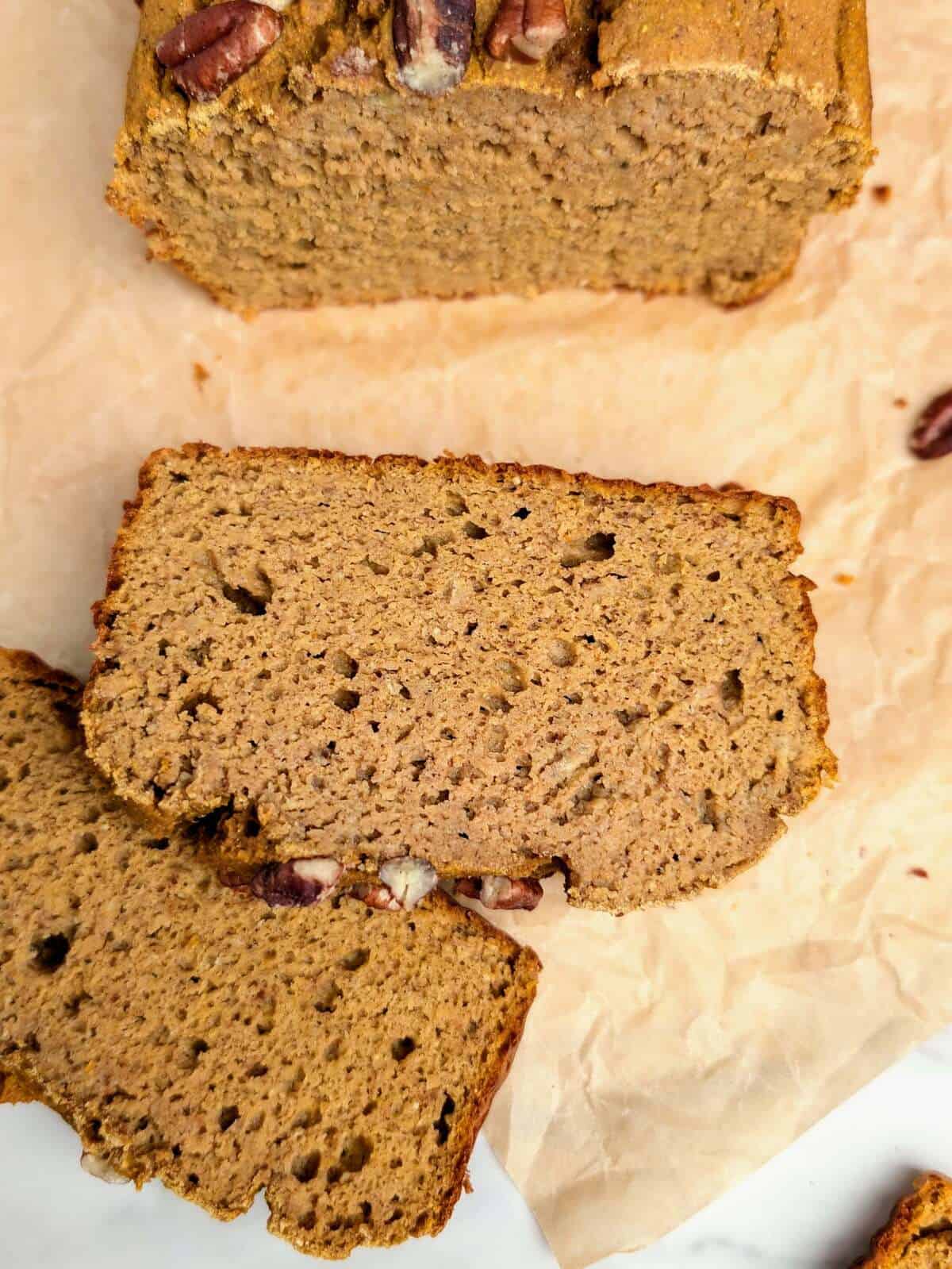 Bake the ultimate high protein healthy pumpkin banana bread! A moist, satisfying protein loaf that's macro-friendly with no added refined sugar.