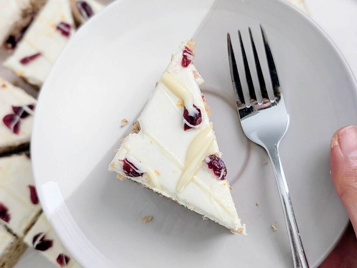 Best Protein Cranberry Bliss Bars recipe that’s heathy, low calorie and has no sugar! The ultimate Starbucks copycat with a cranberry orange blondie and orange zest cream cheese frosting - both with protein powder!