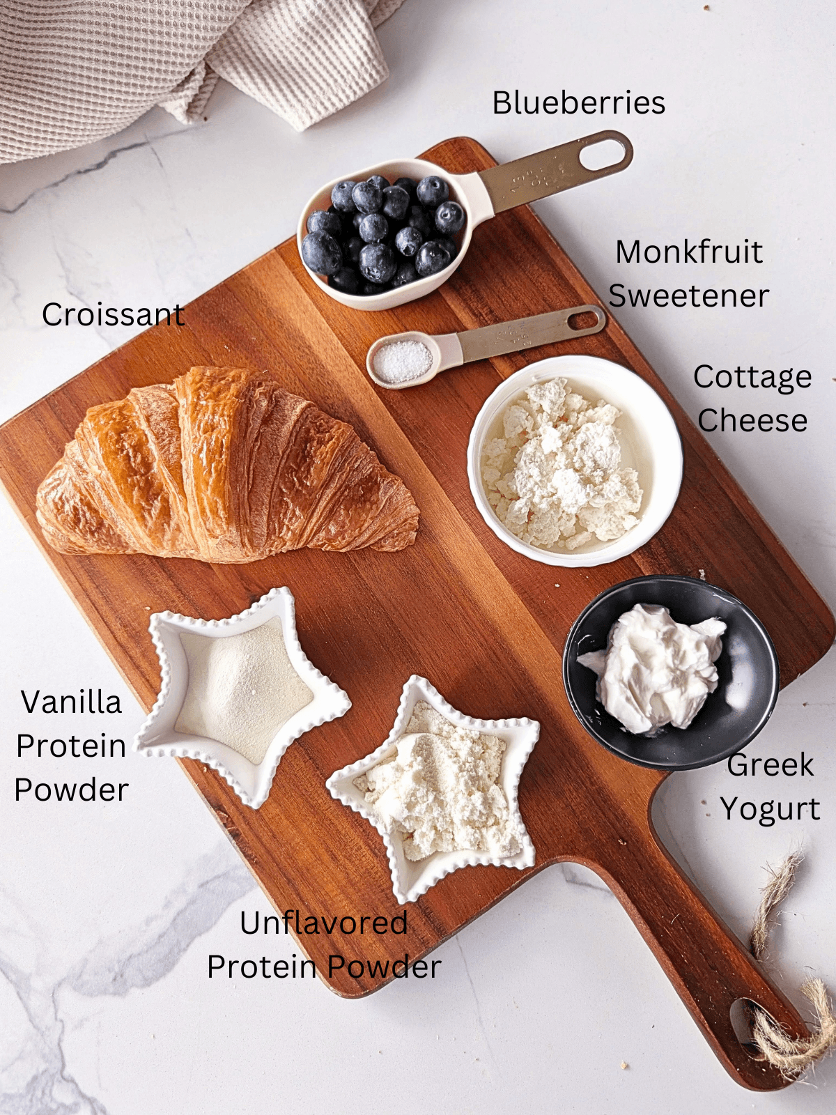 Ingredients for Healthy blueberry cheesecake croissant with protein powder, Greek Yogurt and cottage cheese.