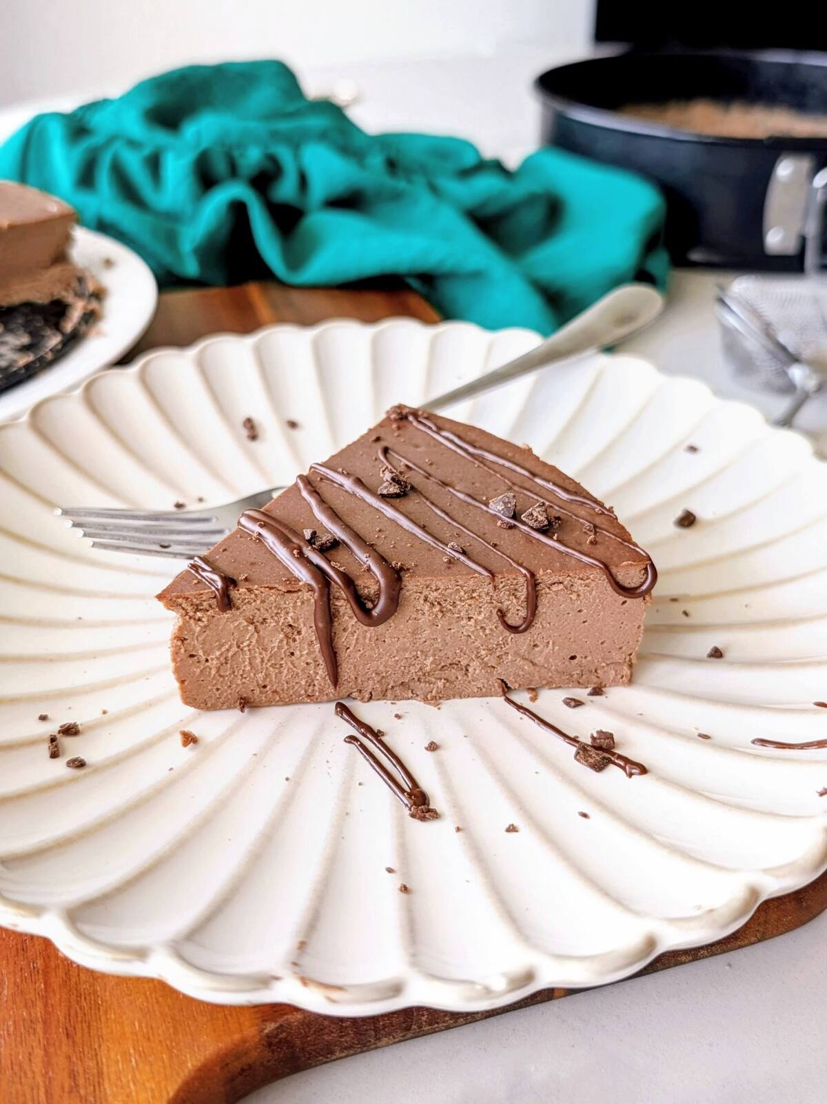 The best high protein chocolate cheesecake recipe! This low fat, low calorie dessert is healthy, creamy, chocolatey, and made easily with Greek yogurt.