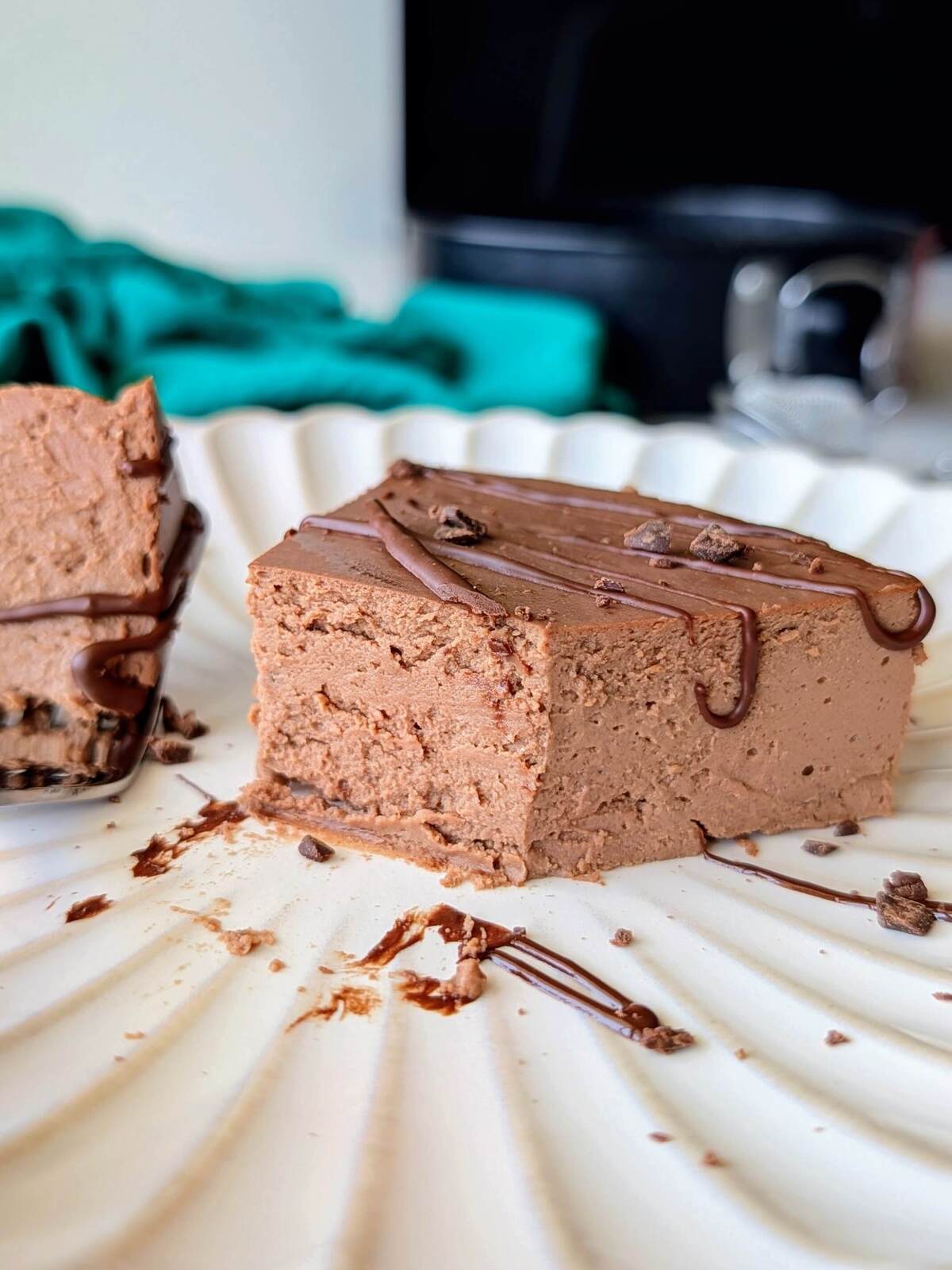 The best high protein chocolate cheesecake recipe! This low fat, low calorie dessert is healthy, creamy, chocolatey, and made easily with Greek yogurt.