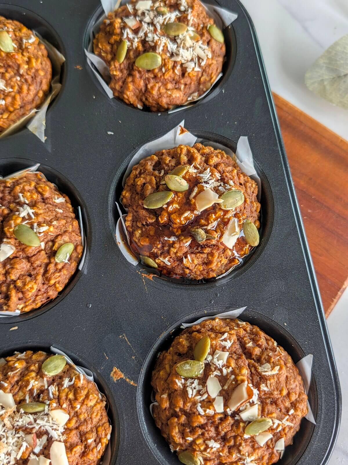 These pumpkin protein muffins without protein powder get 7g of protein each from Greek yogurt, eggs and peanut butter powder, and they're sugar free and easy to make gluten free, which makes them an easy breakfast or snack at 90 calories a muffin.